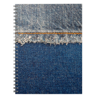 Straight stitch with orange thread on bleached den notebook