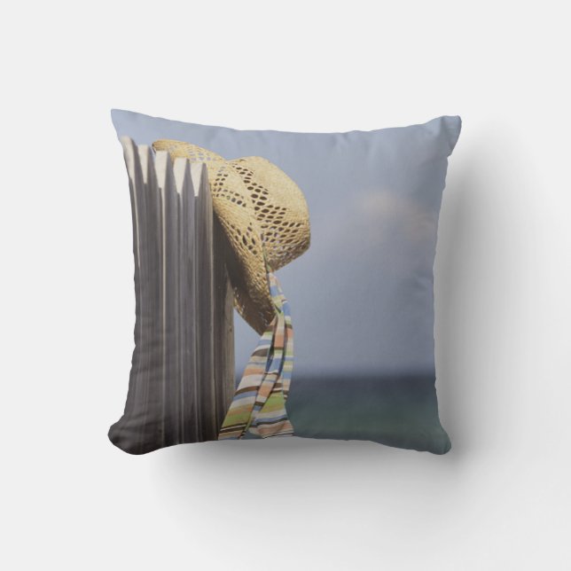 Straw Hat Hanging On Fence At Beach Cushion (Front)