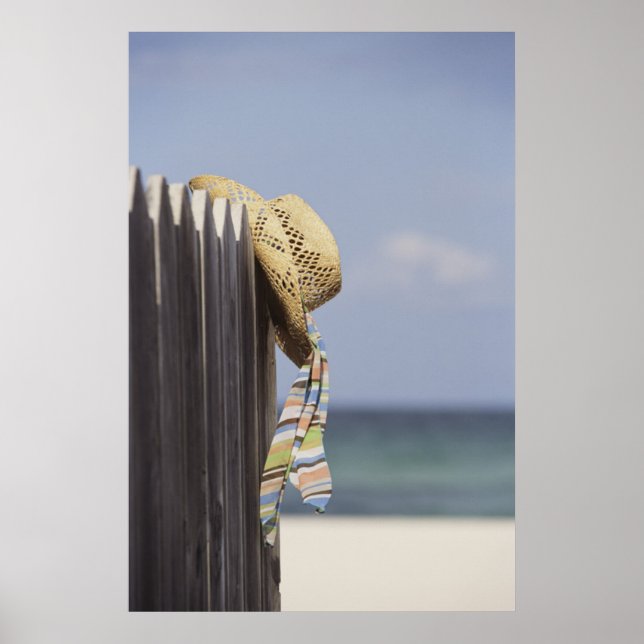 Straw Hat Hanging On Fence At Beach Poster (Front)