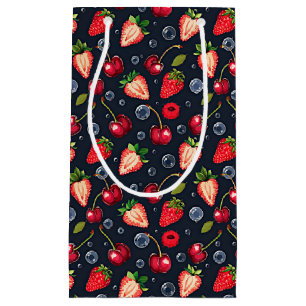 Strawberries and cherries on a dark background small gift bag