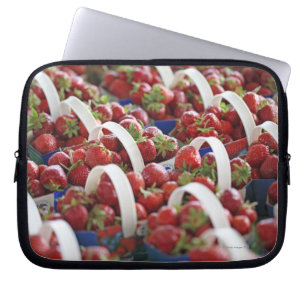 Strawberries at a market stall laptop sleeve