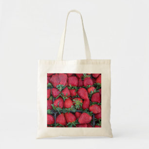 Strawberries with green leaves tote bag
