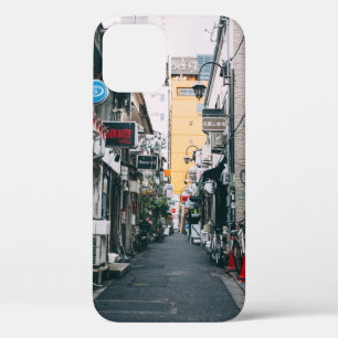 STREET BETWEEN GRAY CONCRETE BUILDINGS iPhone 12 CASE