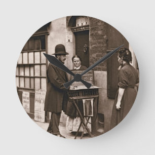 Street Doctor, 1876-77 (woodburytype) Round Clock