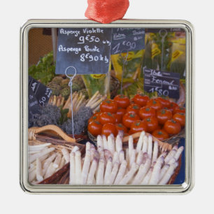 Street market merchant's stall with white metal ornament