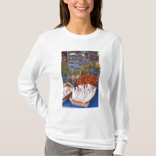 Street market merchant's stall with white T-Shirt