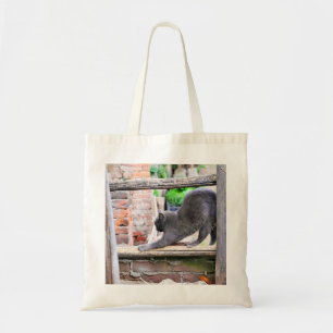 Stretching cat tote bag