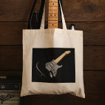 Striking Black Electric Guitar Musical Instrument  Tote Bag<br><div class="desc">Rock your style with our stunning tote bag featuring a sleek graphic of a black electric guitar! Perfect for music lovers and fashion enthusiasts alike, this tote is designed for those who want to make a statement. Crafted from high-quality materials, it offers durability and a spacious interior to carry your...</div>