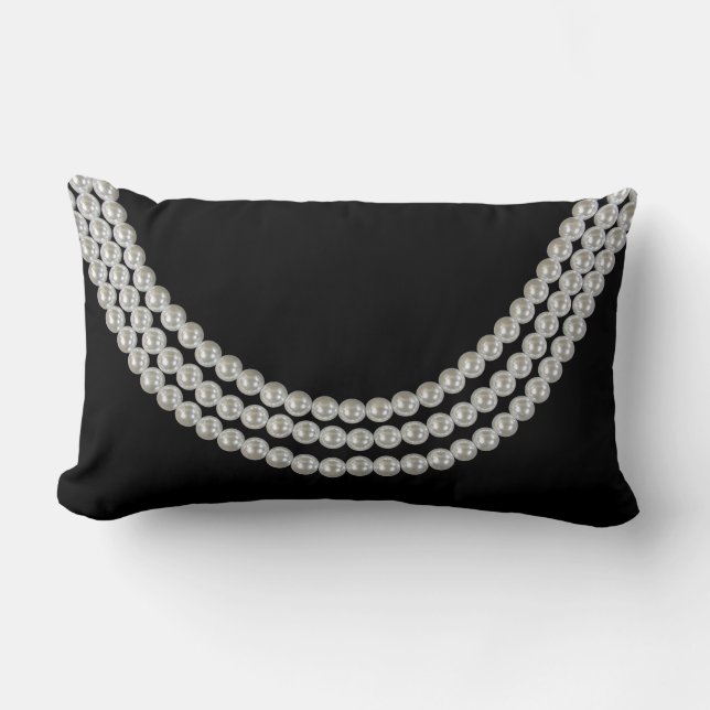 string of white pearls on black lumbar cushion (Front)
