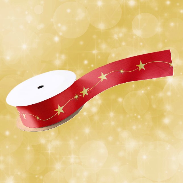String Shiny Gold Twinkle Stars on Vibrant Red Satin Ribbon (Bright shiny twinkle gold stars on string on deep vibrant red Christmas gift or craft ribbon.)