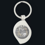 Stringed Lights Wreath Rustic Wedding   Key Ring<br><div class="desc">On this stylish party favour wedding keychain is a grey rustic wood backdrop is a chic floral wreath where you can customise it and above that is a string of lights creating farmhouse romantic elegance.  Part of the Stylish Trendy Wedding Gifts Collection</div>