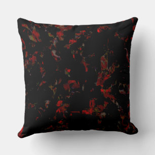 Strong red blots on dark grey rocky base, texture cushion