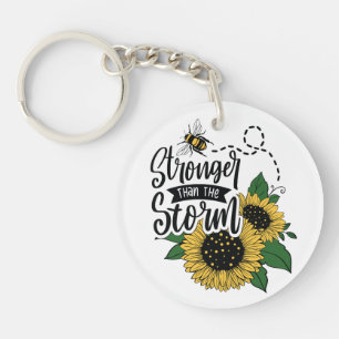 Stronger than the storm. key ring