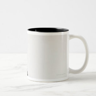Studio shot of black and white cat in gift box Two-Tone coffee mug