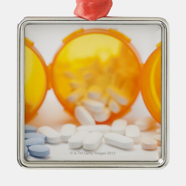 Studio shot of medicine bottle with pills metal ornament (Front)