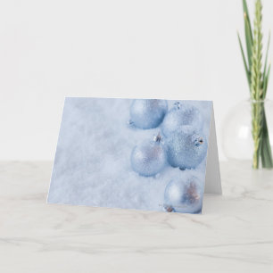 Studio shot of silver Christmas ornament on snow Holiday Card