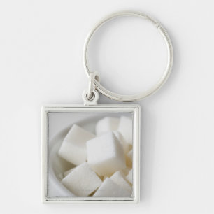 Studio shot of sugar cubes in bowl key ring