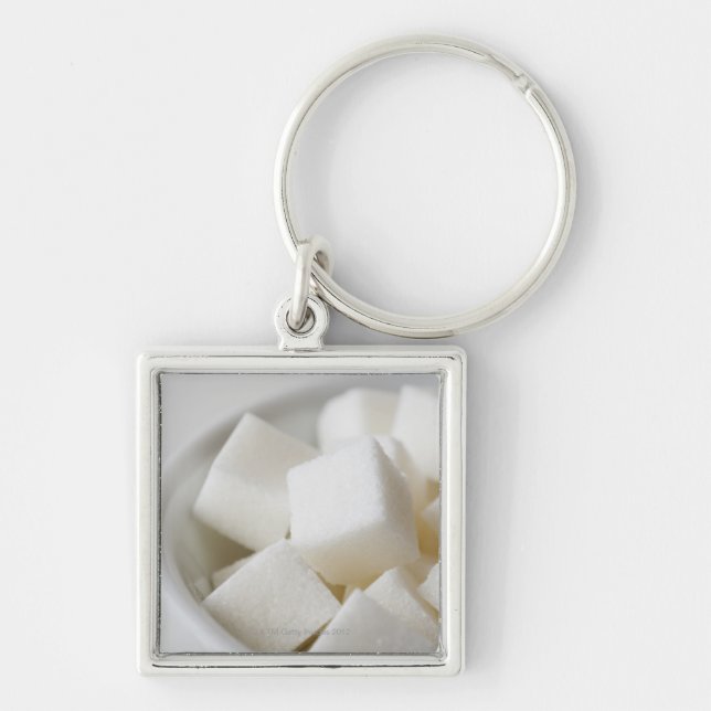 Studio shot of sugar cubes in bowl key ring (Front)