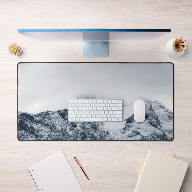 Stunning snowy mountains covered by clouds desk mat (Office 1)