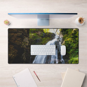 Stunning waterfall with sunlight glow desk mat