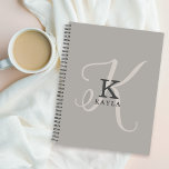 Stylish Feminine Monogram on Neutral Background Planner<br><div class="desc">Stylish and beautiful, this unique feminine monogram design displays the initial of your first name in both a simple serif font and an elegant calligraphy font in the background. Your name is displayed below your monogram initial in this unique typography custom design. The three elements blend together with a sophisticated...</div>