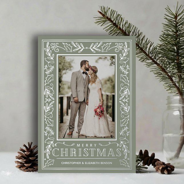 Stylish Greenery Christmas Photo Silver Foil Holiday Card (Stylish REAL SILVER FOIL winter foliage border on sage green photo Christmas holiday cards)