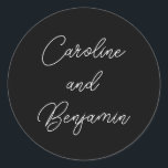 Stylish Modern Script Wedding Names Black Classic Round Sticker<br><div class="desc">This elegant, personalised wedding sticker features a minimalist black background with graceful white script, perfect for adding a stylish and modern touch to wedding favours, invitations, or save-the-dates. With customisable names, it’s an ideal way to bring a personalised element to any wedding theme, especially monochrome or classic styles. These versatile...</div>