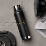 Stylish Monogram With Couple Name Black Water Bottle<br><div class="desc">Elevate your hydration with this stylish black water bottle featuring a custom monogram and couple names. Sleek and durable,  it’s perfect for daily use,  special events,  or gifting. Combines practical functionality with personalized charm for a modern,  memorable accessory.</div>