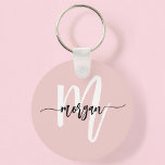 Stylish Pink Modern Script Girly Monogram Name Key Ring<br><div class="desc">Elevate your everyday essentials with the Stylish Pink Modern Script Girly Monogram Name Keychain. This elegant accessory showcases a blush pink background with a delicate monogram in modern script, adding a personal touch to your keys. Made from high-quality materials, this keychain is both durable and fashionable, making it a perfect...</div>