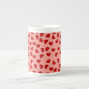 Stylish red heart pattern on peach pink bone china mug