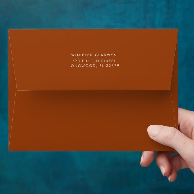Stylish retro burnt orange wedding invitation envelope (Hand)