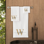 Stylish Script Modern White Gold Monogram Name Bath Towel Set<br><div class="desc">Stylish Girly Feminine Modern White and Gold Monogram Initial Name Signature Script Custom Personalised Bath Towel Set. Featuring a first name (or family name) in a pretty hand lettered style swash tail font typography (or calligraphy) with monogram initial in gold and black on white colour background. Great stylish feminine housewarming...</div>