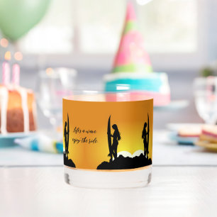 Stylish silhouette female surfer sunset beach whiskey glass