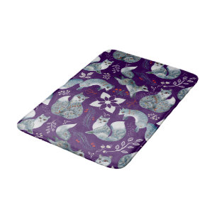 Stylized blue foxes with intricate floral designs Bath Mat