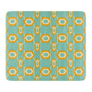 Stylized geometric pattern in bold orange hexagon cutting board