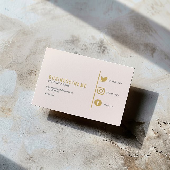 Subtle pink social media icons fun business card (Modern gold and subtle pink business card with social media icons and minimalist layout.)