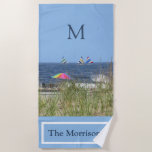 Summer at the Beach Ocean Sand Monogram Name Beach Towel<br><div class="desc">From the Charm Design Studio -- Relax and Enjoy -- a day at the beach -- the Ocean / sand / grasses / colourful umbrellas / small sailboats in the distance -- family name and monogram -- for you to enjoy always or as a wonderful gift.</div>
