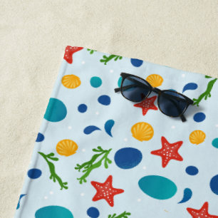 Summer beach with starfish, shells and pebbles towel