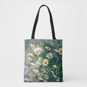 Summer flower pattern in green meadow with blue an tote bag