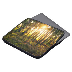 Sun beams shines in pine forest laptop sleeve