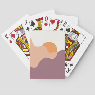 Sun goes down behind the purple hills playing cards