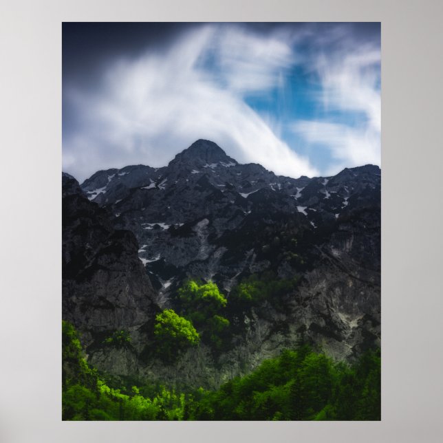 Sun lit green forest beneath the mountains poster (Front)