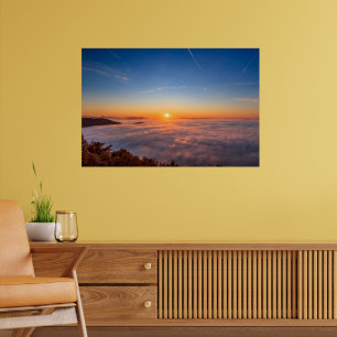Sun peaking above clouds in the morning poster