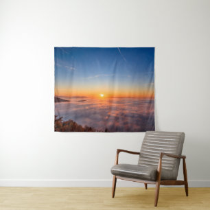Sun peaking above clouds in the morning tapestry