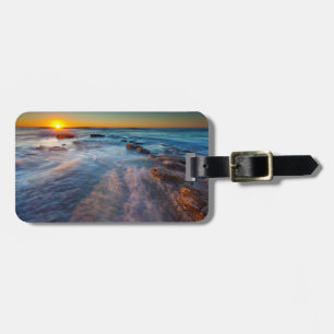Sun rays illuminate the Pacific Ocean Luggage Tag