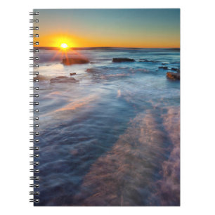 Sun rays illuminate the Pacific Ocean Notebook