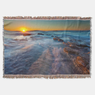 Sun rays illuminate the Pacific Ocean Throw Blanket