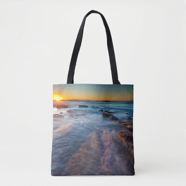 Sun rays illuminate the Pacific Ocean Tote Bag (Front)