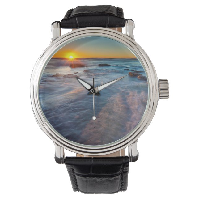 Sun rays illuminate the Pacific Ocean Watch (Front)