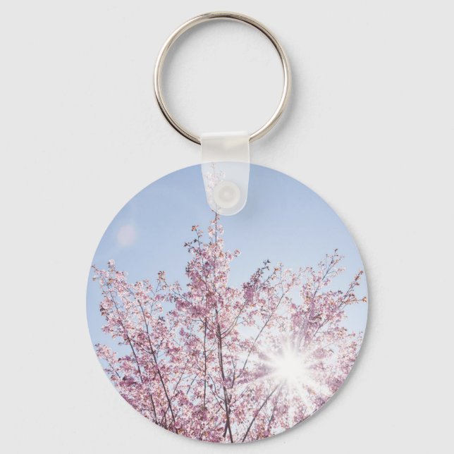 sun rays pass through pink flowers of a wow tree key ring (Front)